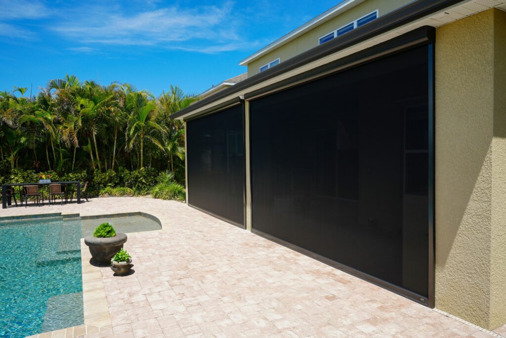 Patio screen system creating a shaded outdoor living area